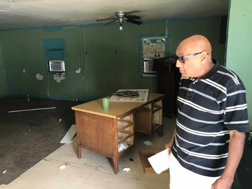 Pervez Raza, owner of the home at 2401 Penn St. in Irving, oversees cleanup of a grupo after...