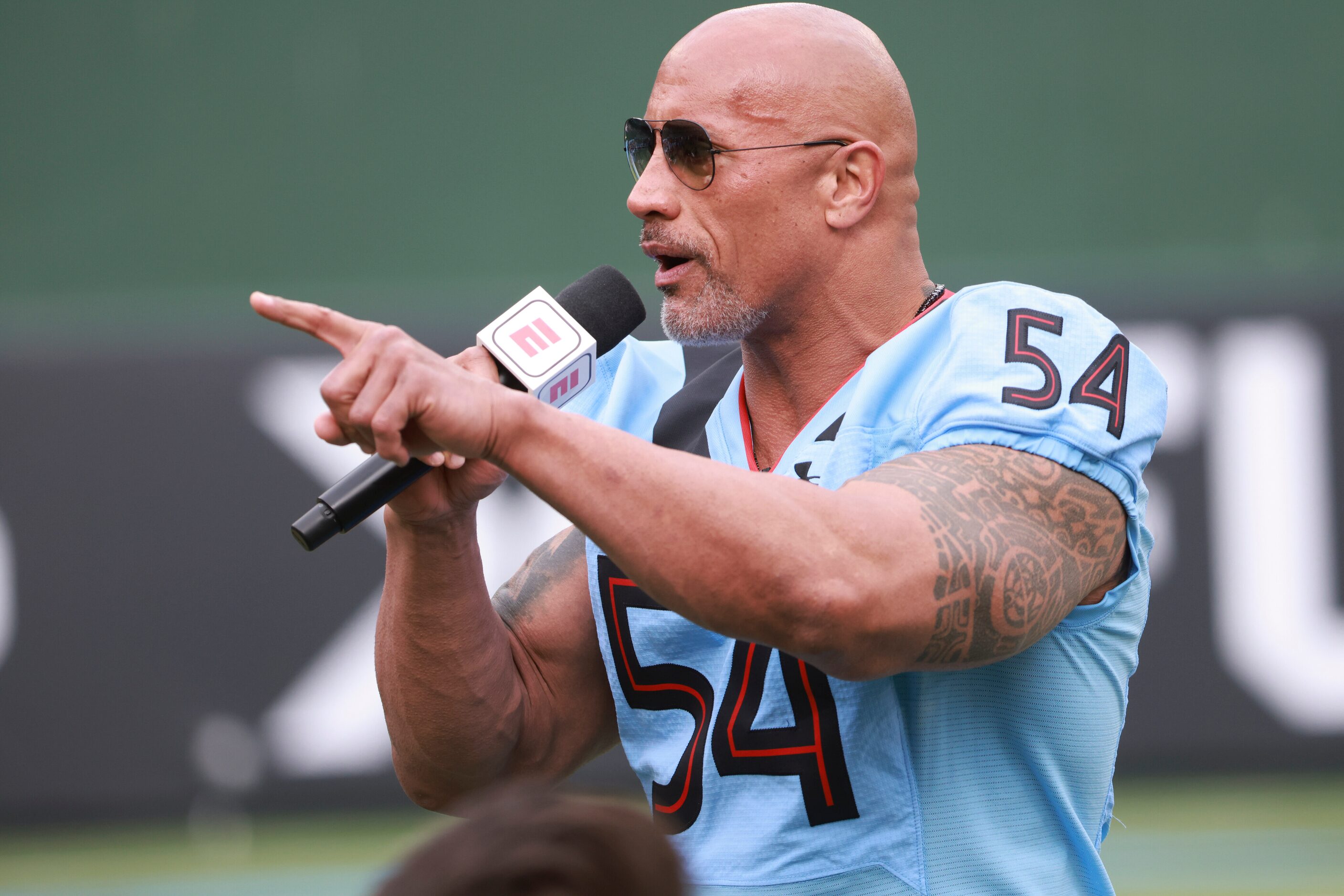 Dwayne “The Rock” Johnson hypes up the Arlington Renegades and crowd before the game at...