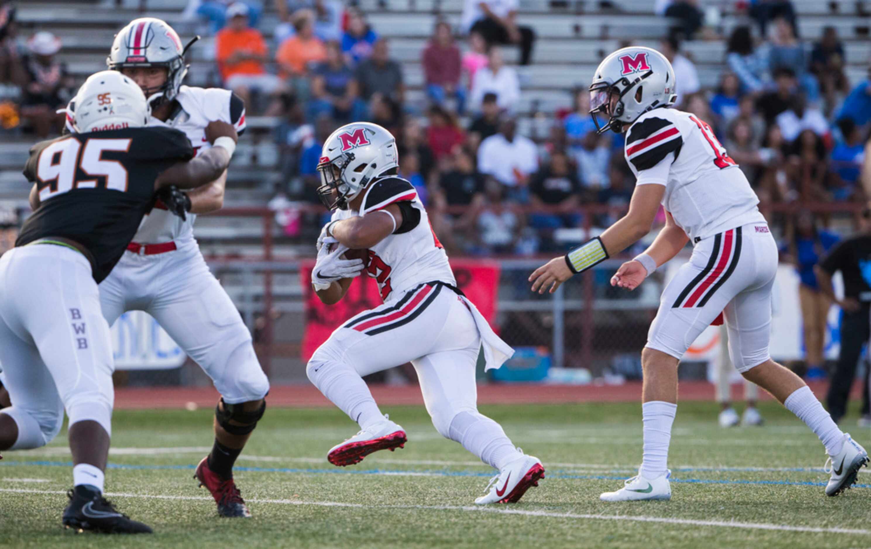 Flower Mound Marcus running back Ty'son Edwards (22) runs to the end zone for a touchdown...