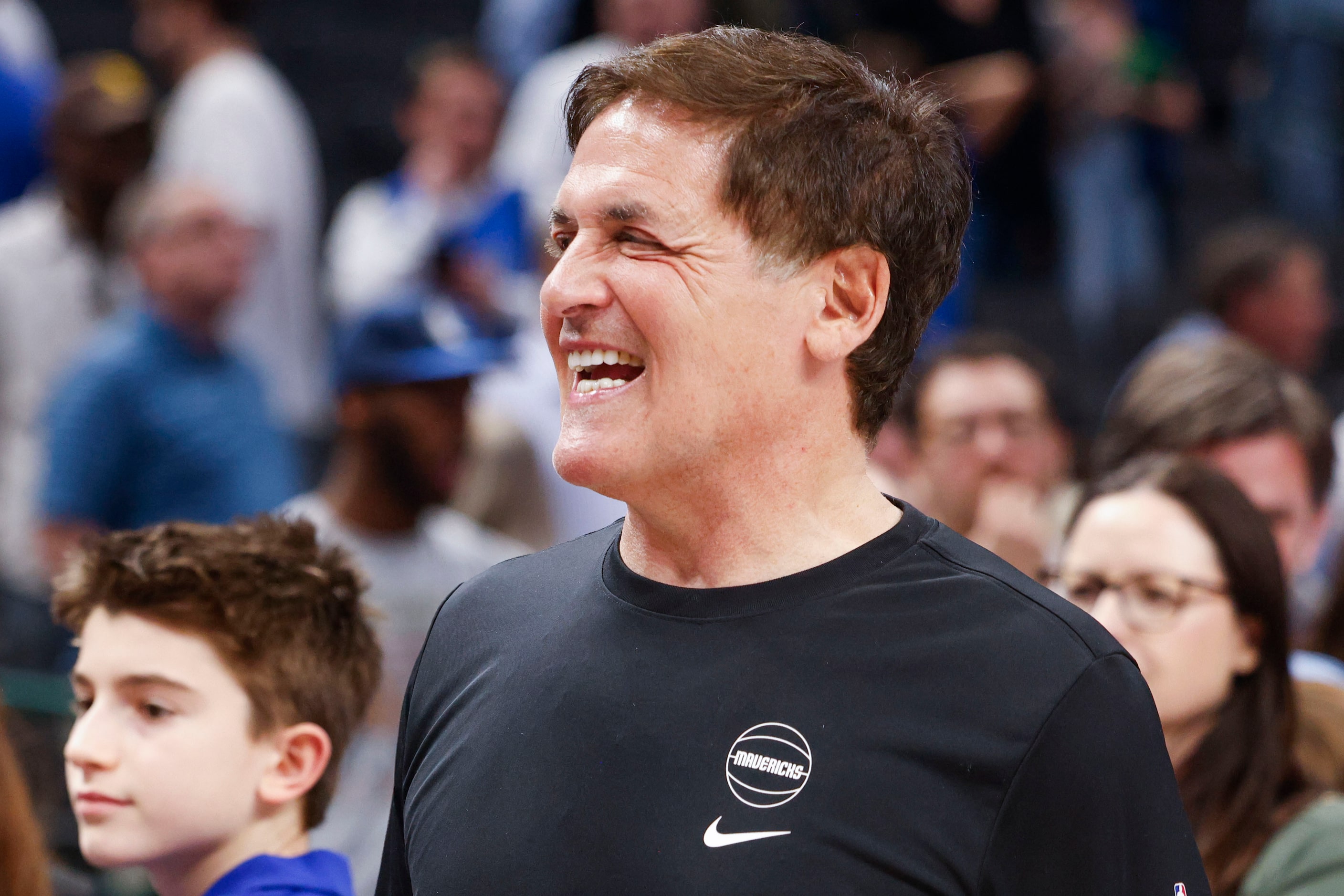 Dallas Mavericks alternate Governor Mark Cuban exits the court after an NBA basketball game...