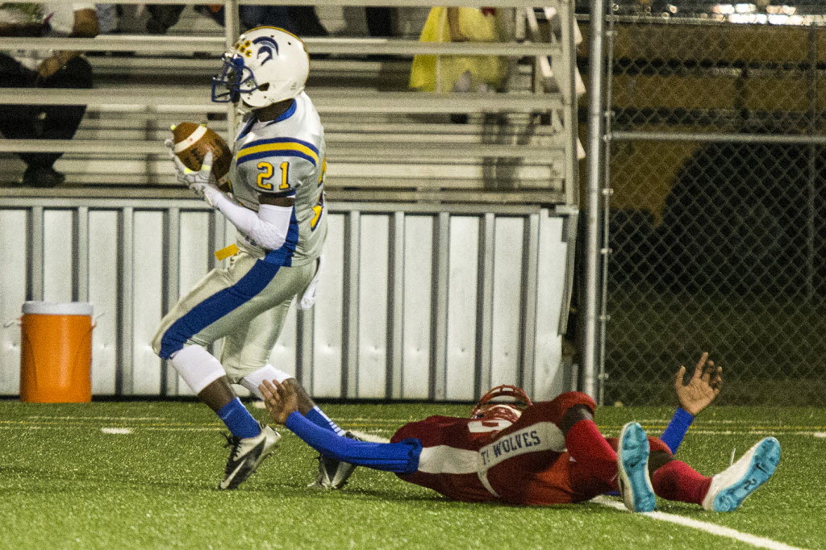 Samuell's Za'Marius Modester (21) catches an interception during W. W. Samuell's matchup...