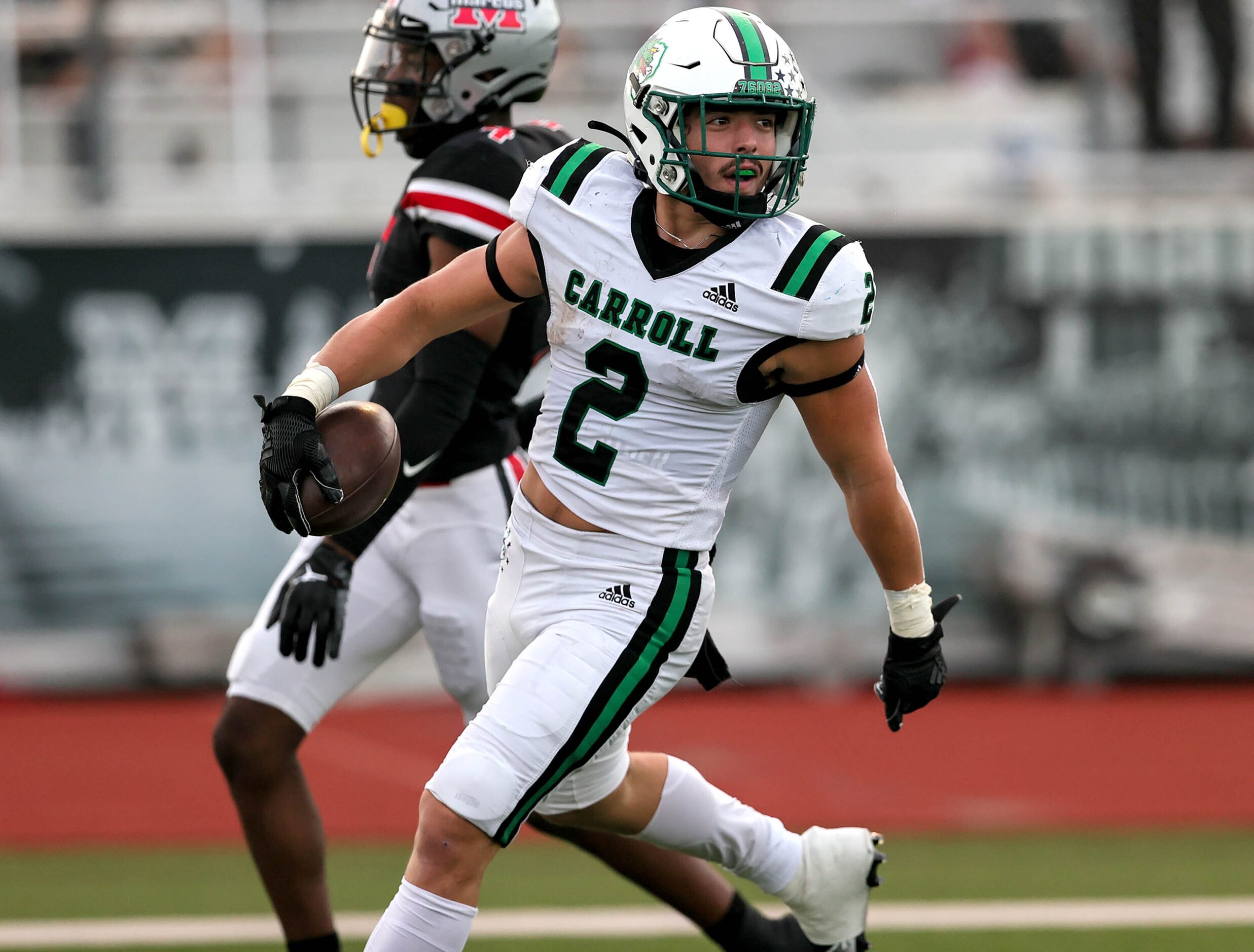 Southlake Carroll running back Owen Allen (2) scores two touchdowns against Flower Mound...