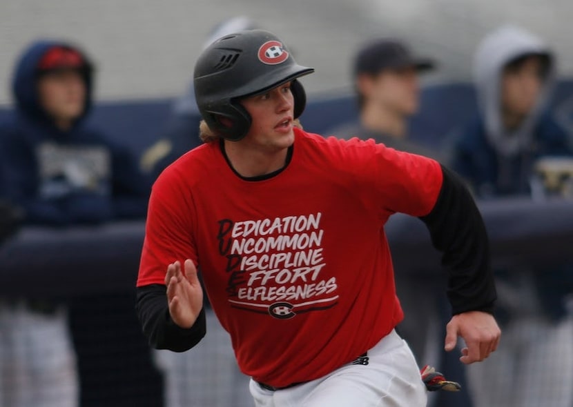 Mason Greer glances over his shoulder to ensure a teammate's drive to the outfield drops...