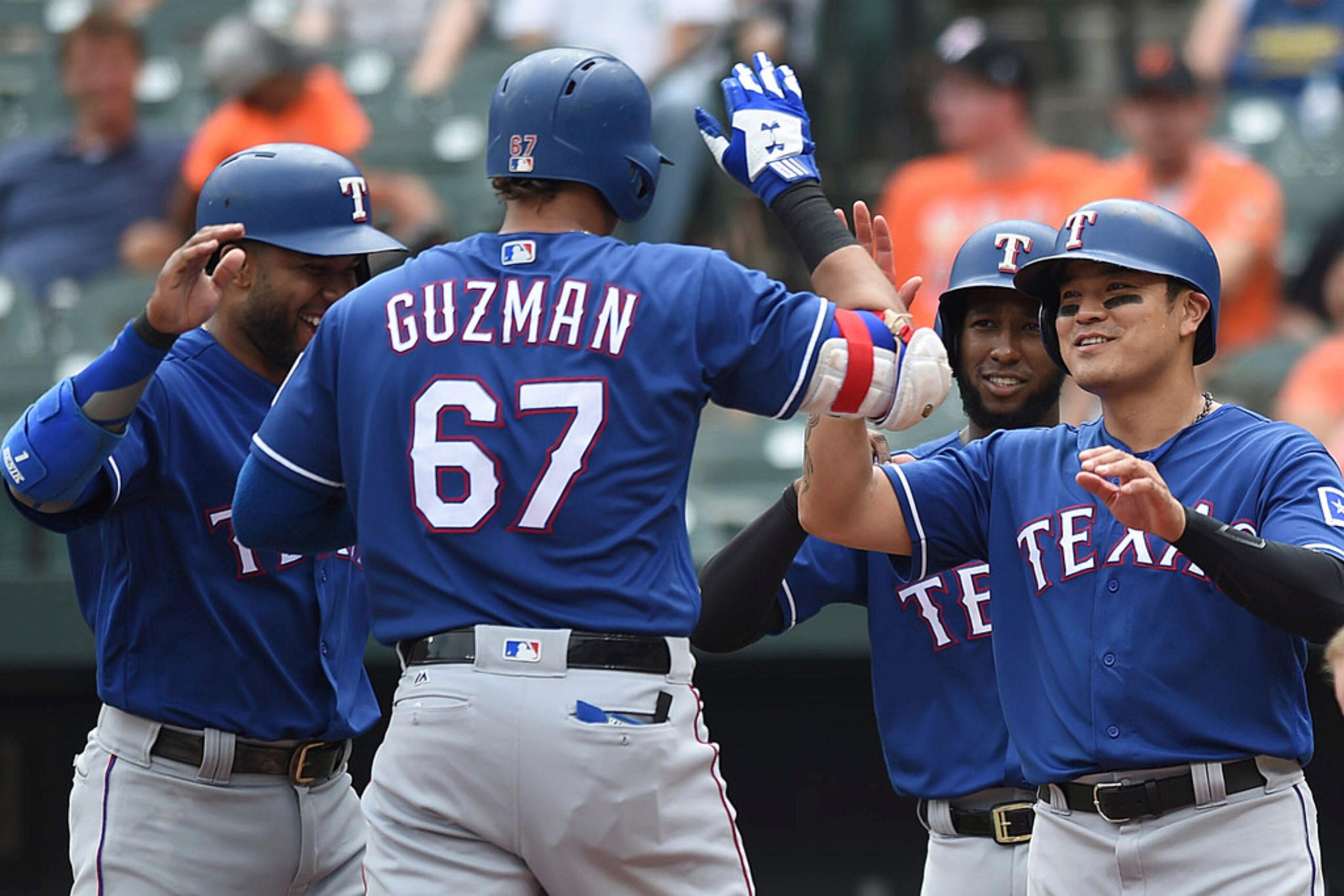 Texas Rangers', left to right, Elvis Andrus, Jurickson Profar and Shin-Soo Choo congratulate...