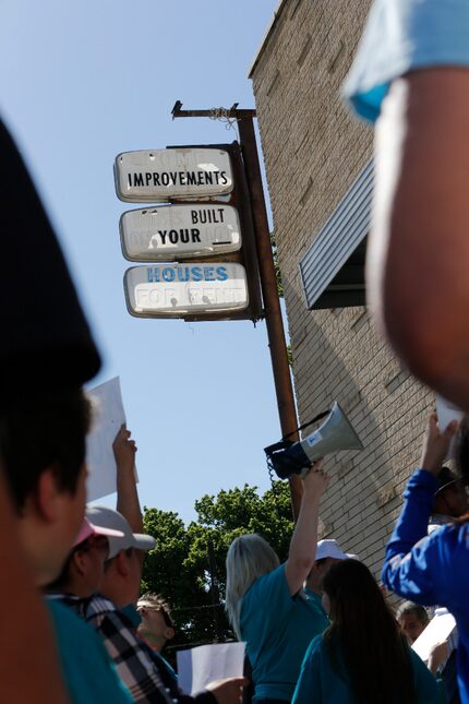 HMK tenants and their supporters rallied in front of the landlord's headquarters on...