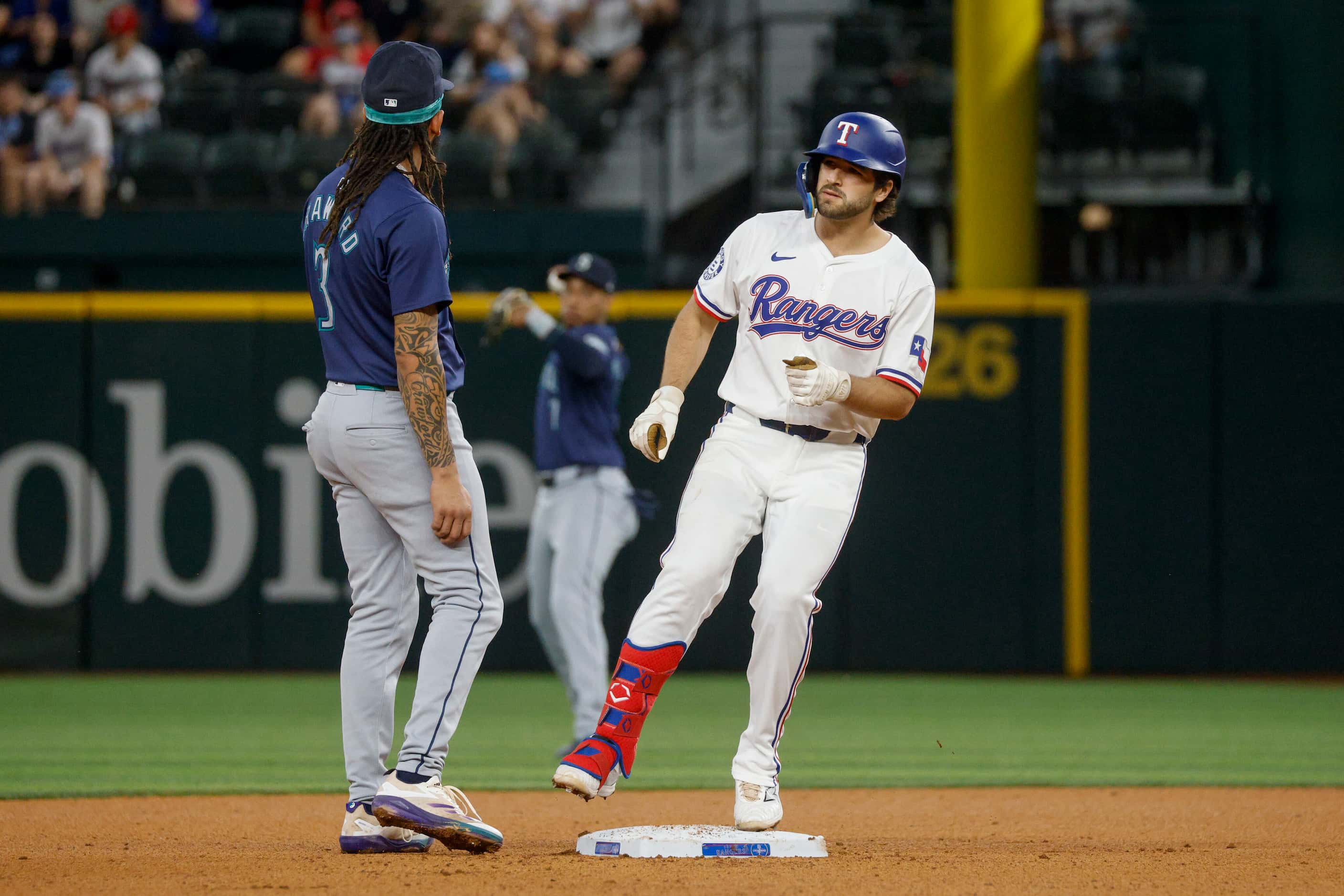 Texas Rangers third baseman Josh Smith (8) reaches second base after a hit during the fourth...