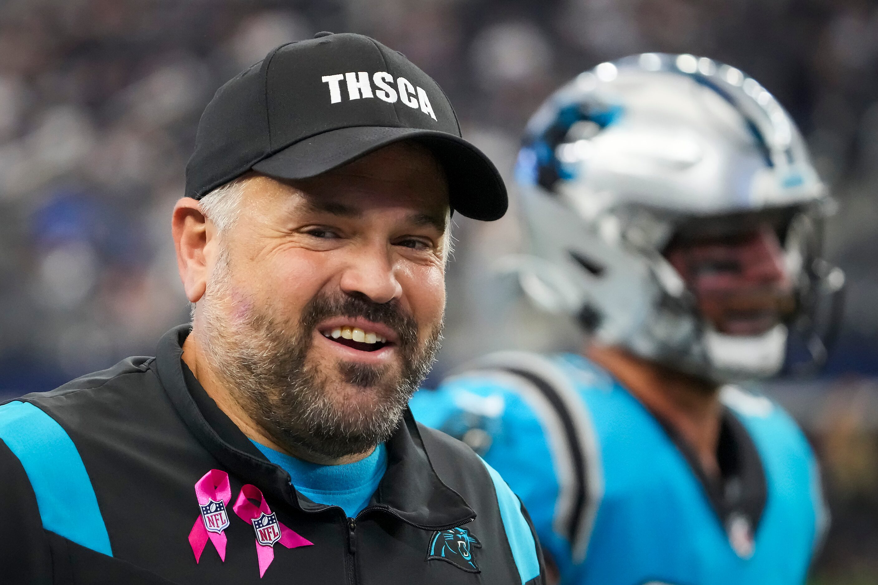 Carolina Panthers head coach Matt Rhule wears a Texas High School Coaches Association hat as...