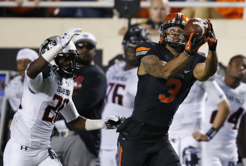 Oklahoma State wide receiver Marcell Ateman (3) reaches for but can't hold on to a pass in...