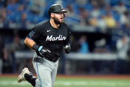 Miami Marlins' Jake Burger runs the bases after his solo home run off Tampa Bay Rays relief...