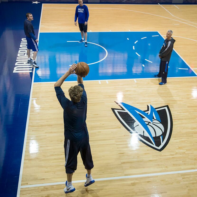 Dallas Mavericks forward Dirk Nowitzki warms up on the team's practice court before an NBA...