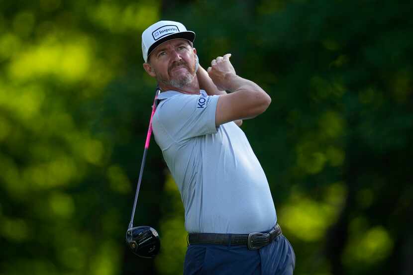 Jimmy Walker hits off the tee on the second hole during the first round of the John Deere...