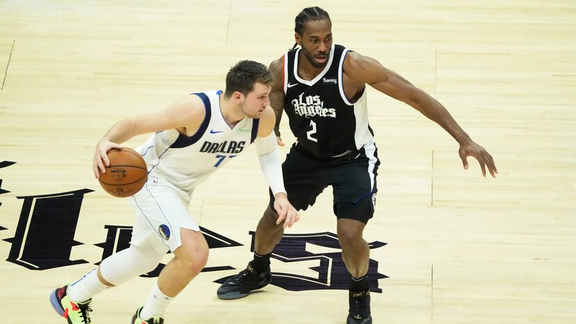 Dallas Mavericks guard Luka Doncic drives on LA Clippers forward Kawhi Leonard during Game 7...