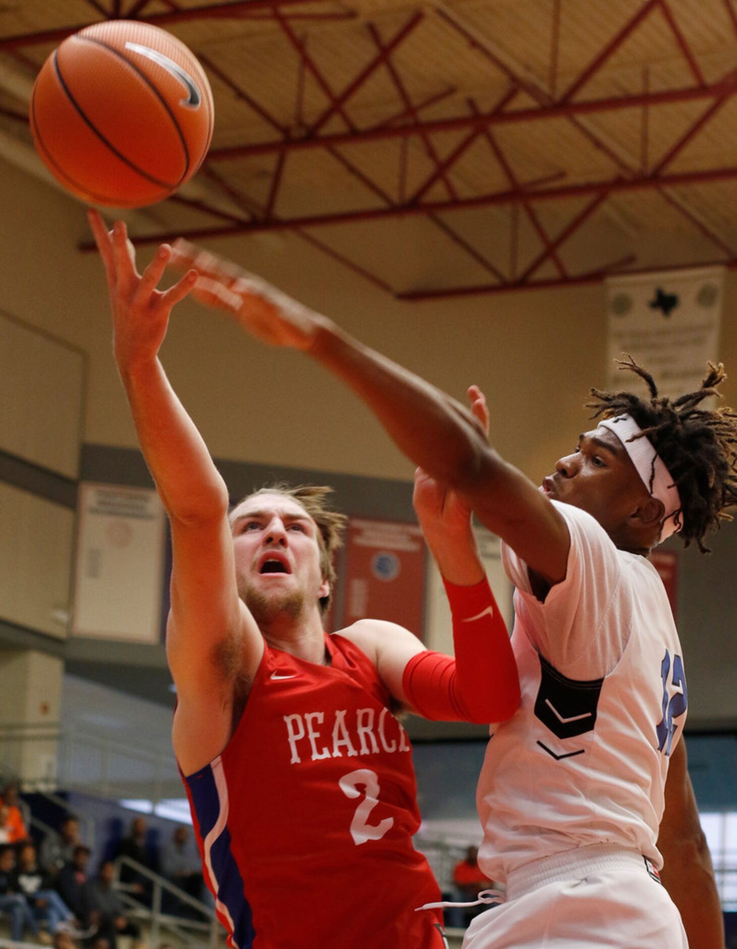 Richardson JJ Pearce post Drew Timme (2) shoots over the tight defense of Trinity Christian...