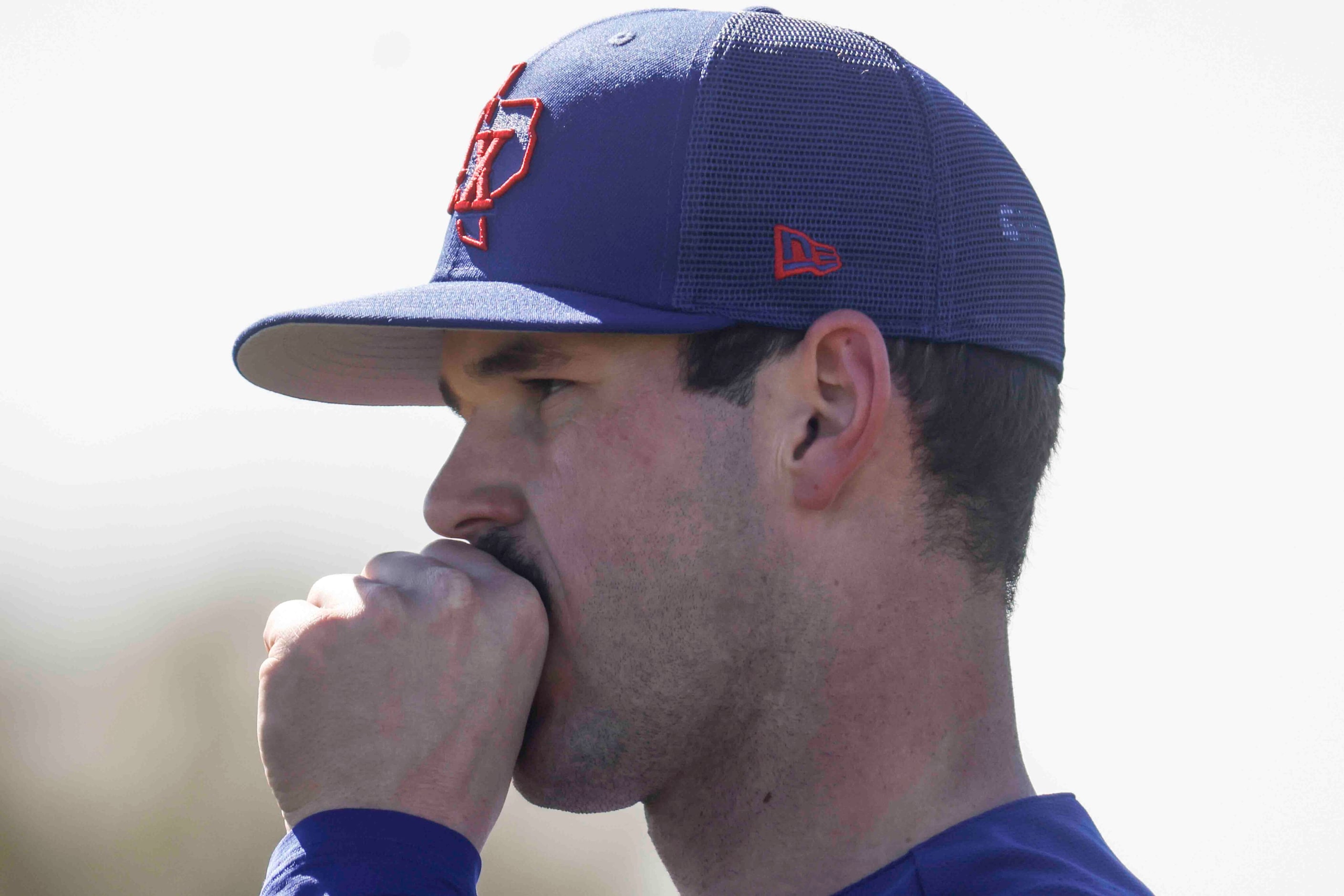 Texas Rangers left handed pitcher Cole Ragans warms his hand as he participates in a drill...