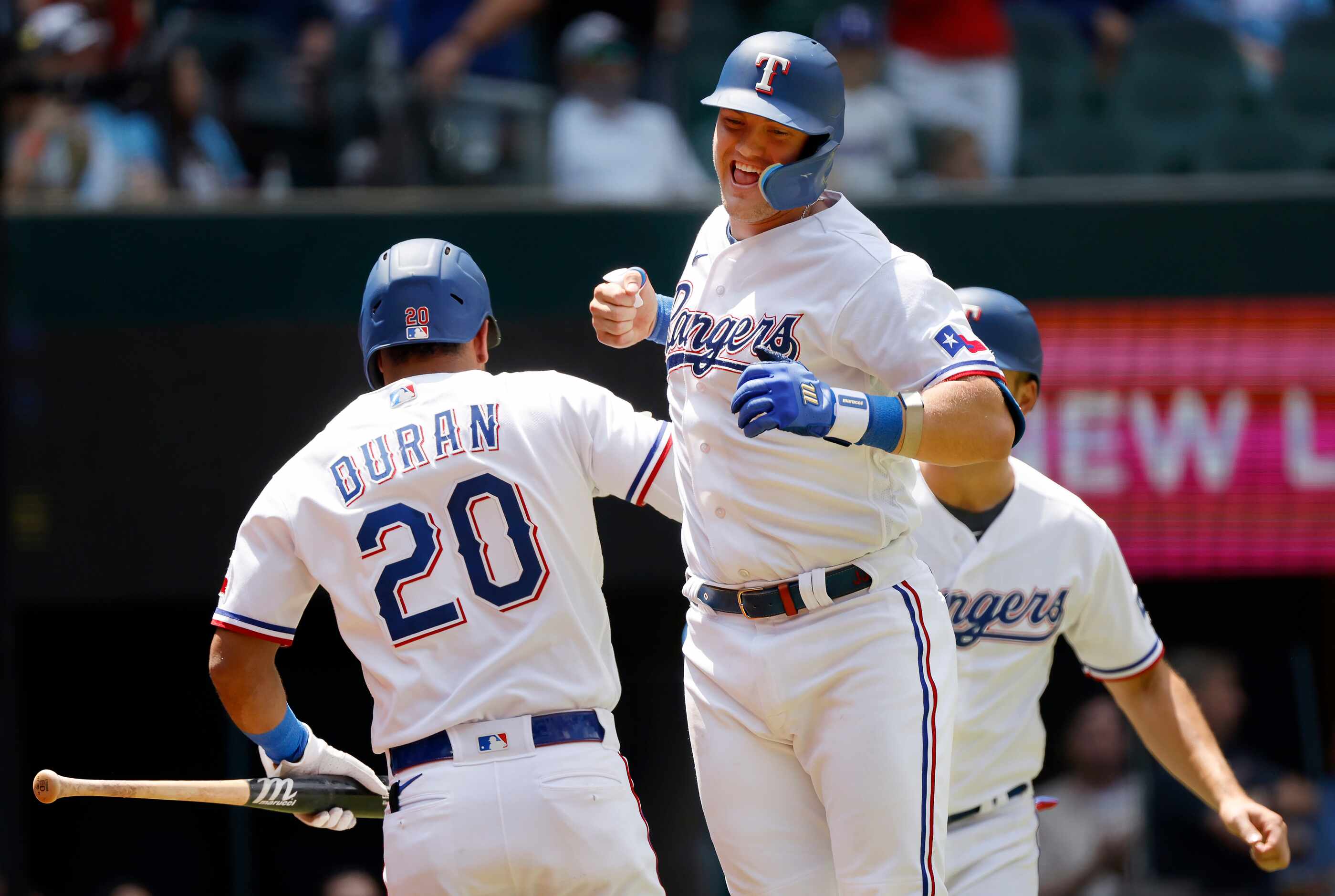 Texas Rangers third baseman Josh Jung (6)  celebrates his two-run homer with teammate...