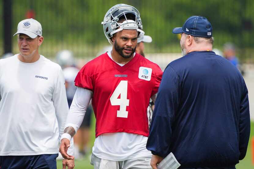 Dallas Cowboys quarterback Dak Prescott (4) talks with head coach Mike McCarthy (right)...