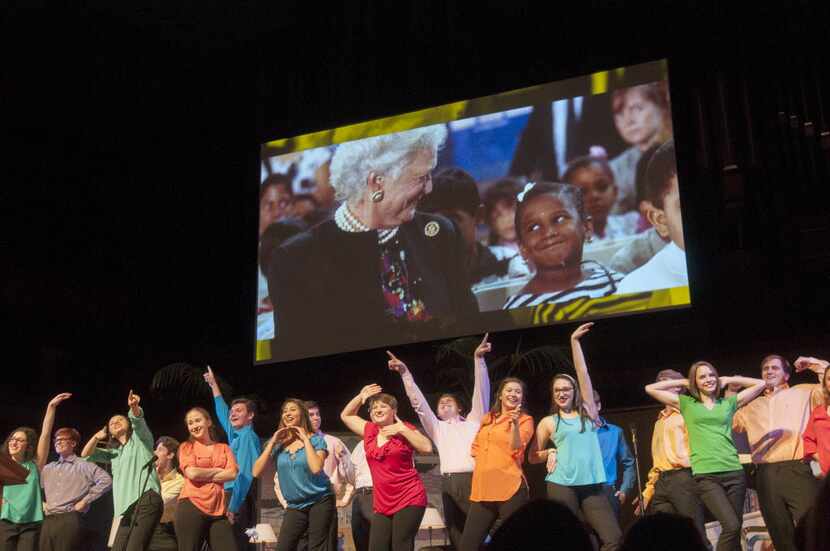 Students from three Richardson high schools danced during a video presentation at the start...