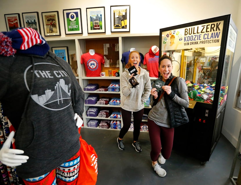 Dallas friends Emiley (cq) Walker (left) and Sarah Kendrick show off the koozies they...