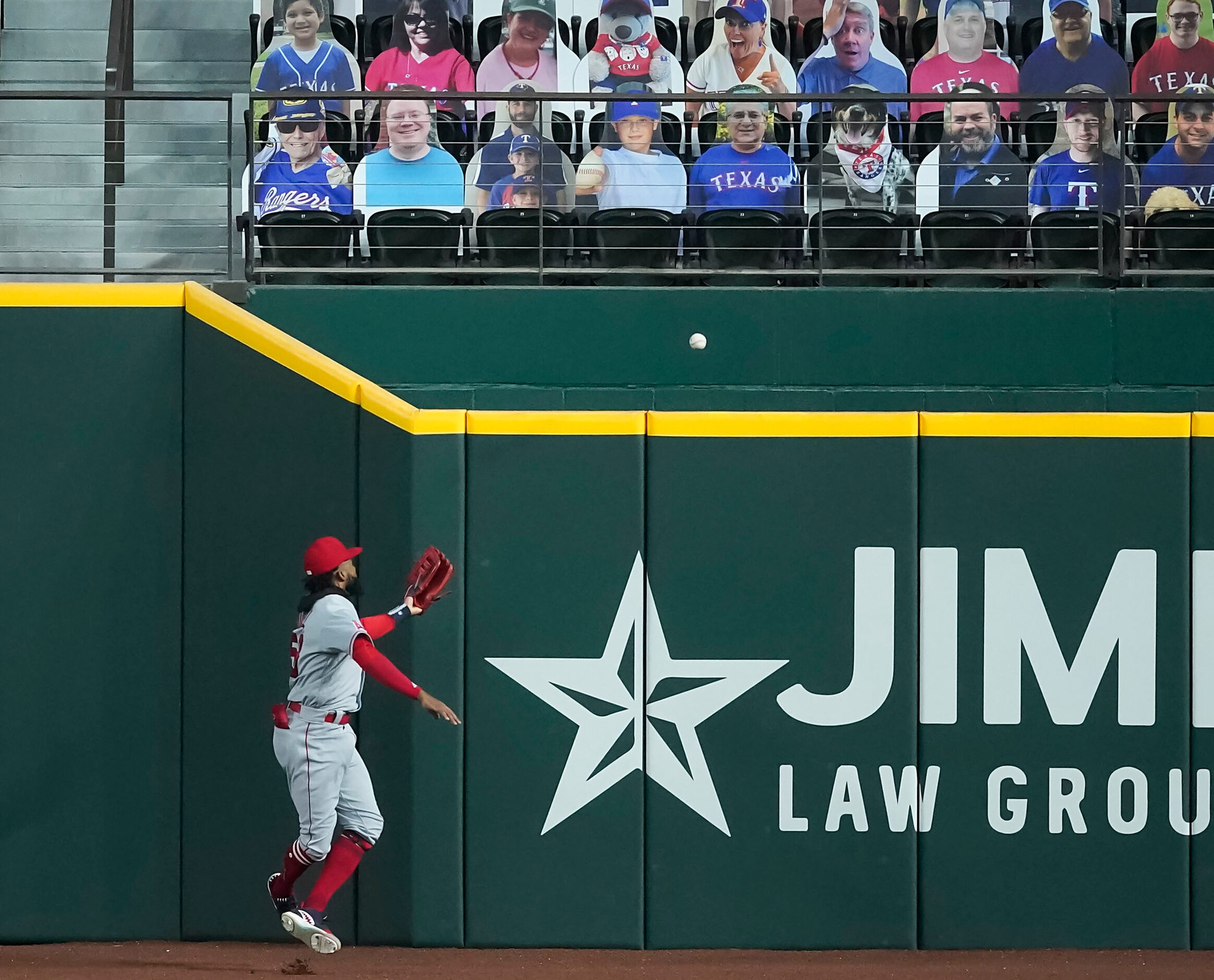 SEQUENCE TWO-OF-FOUR: Los Angeles Angels right fielder Jo Adell has the ball go off his...