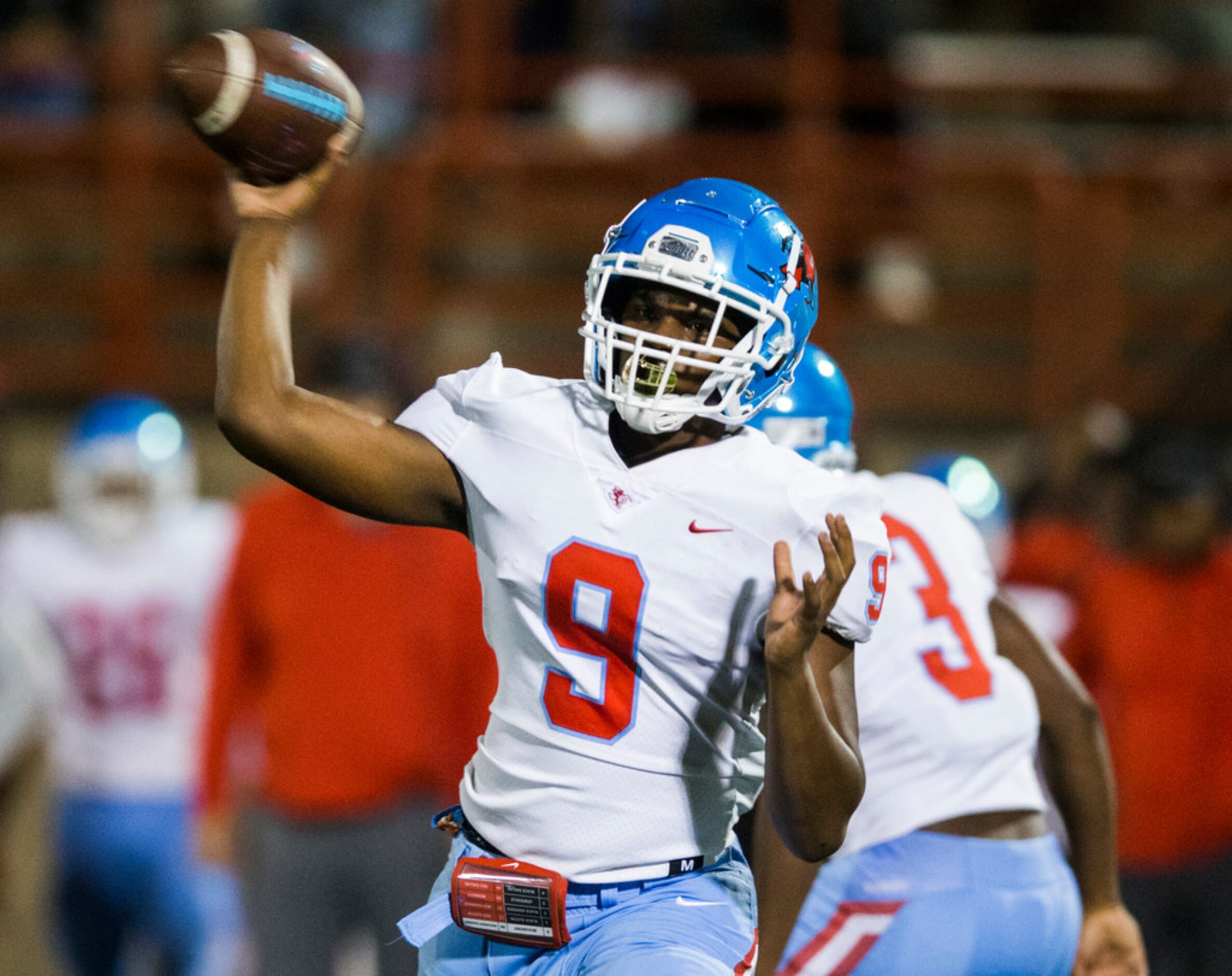 Skyline quarterback Darryl Richardson (9) throws a pass during the first quarter of a high...