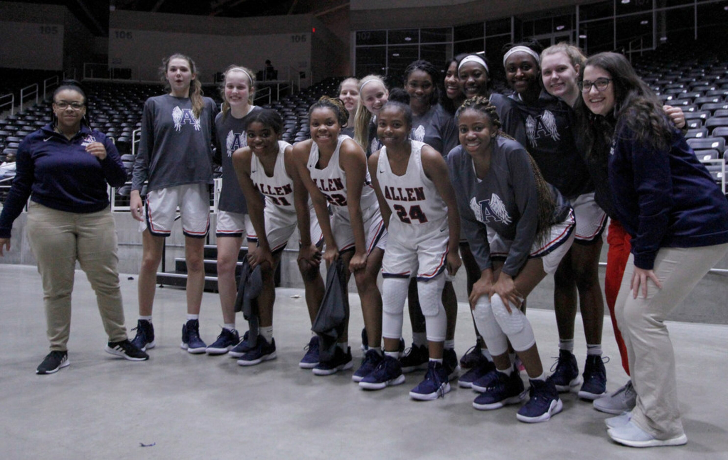 Members of the Allen Lady Eagles pose for a group photo following their 50-49 victory over...