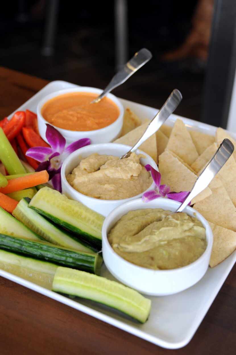 The hummus trio includes fresh vegetables and pita bread at Pinstack.