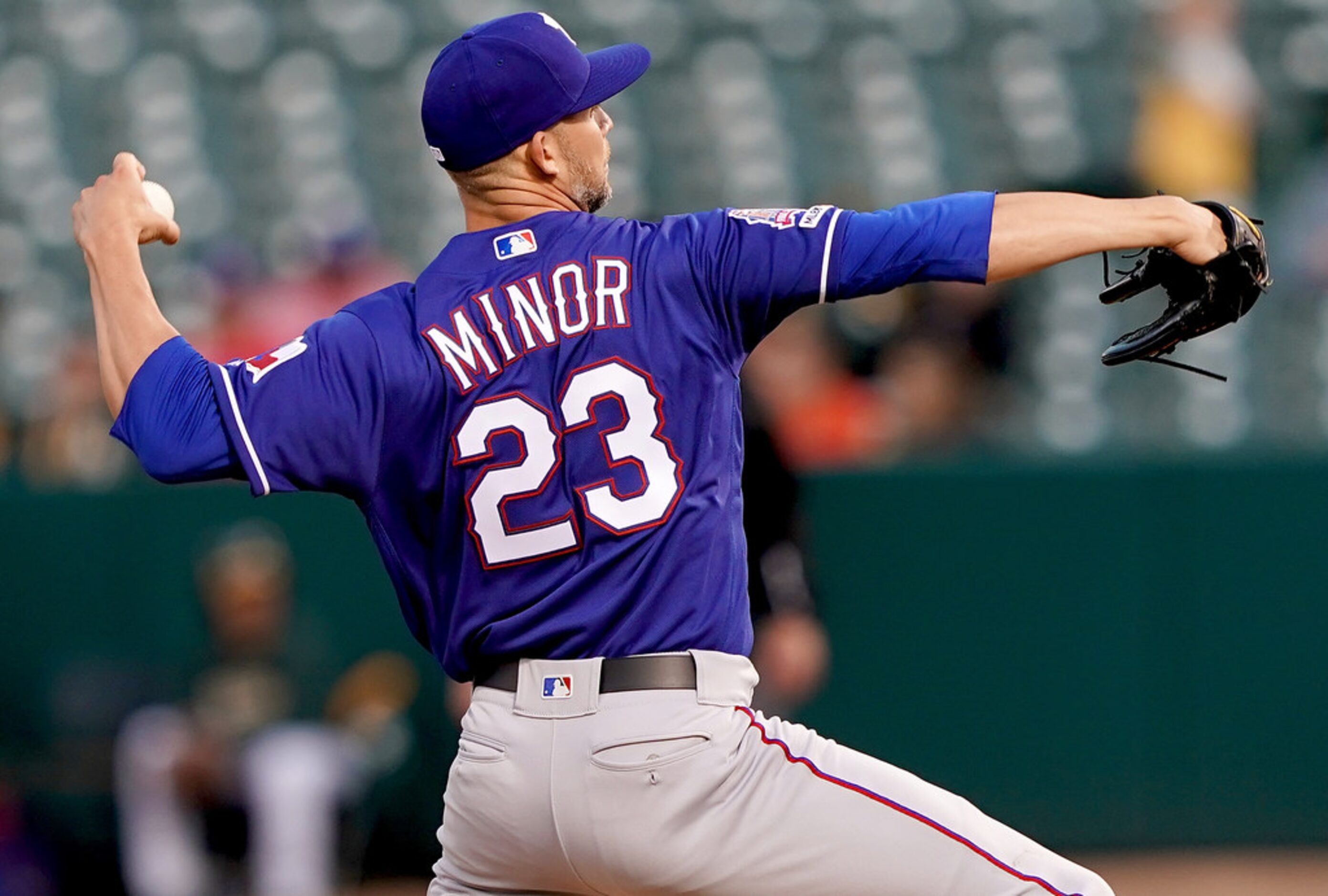 OAKLAND, CA - APRIL 22:  Mike Minor #23 of the Texas Rangers pitches against the Oakland...