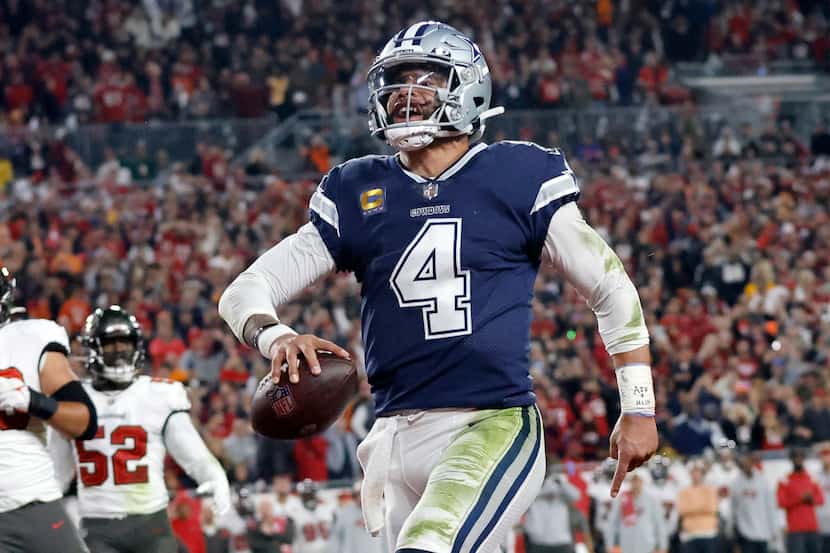 Dallas Cowboys quarterback Dak Prescott (4) celebrates his econd quarter touchdown run...