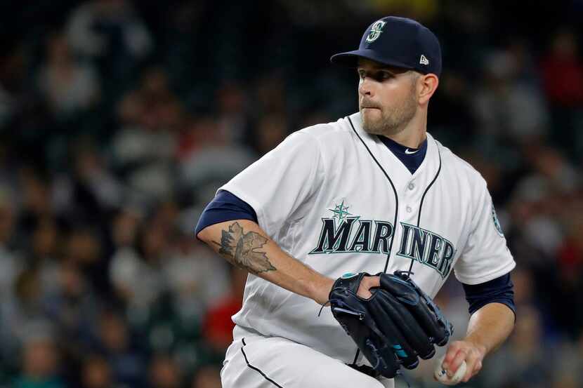 Seattle Mariners starting pitcher James Paxton throws to a Detroit Tigers batter during the...