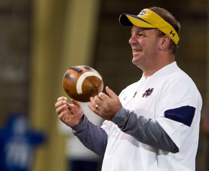 In this March 22, 2017, file photo, Notre Dame defensive coordinator Mike Elko runs drills...