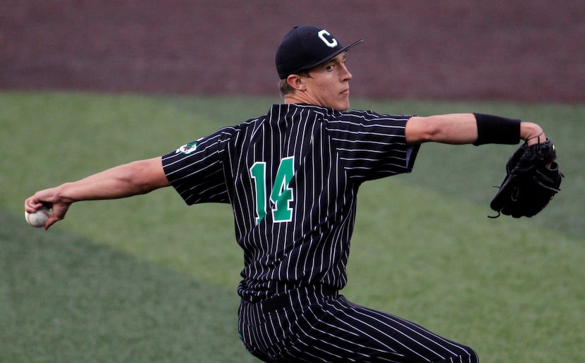 Southlake Carroll pitcher Griffin Herring (14) delivers a pitch to a Keller batter during...