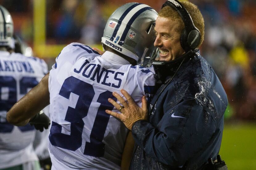 Dallas Cowboys free safety Byron Jones (31) gets a hug from head coach Jason Garrett after...
