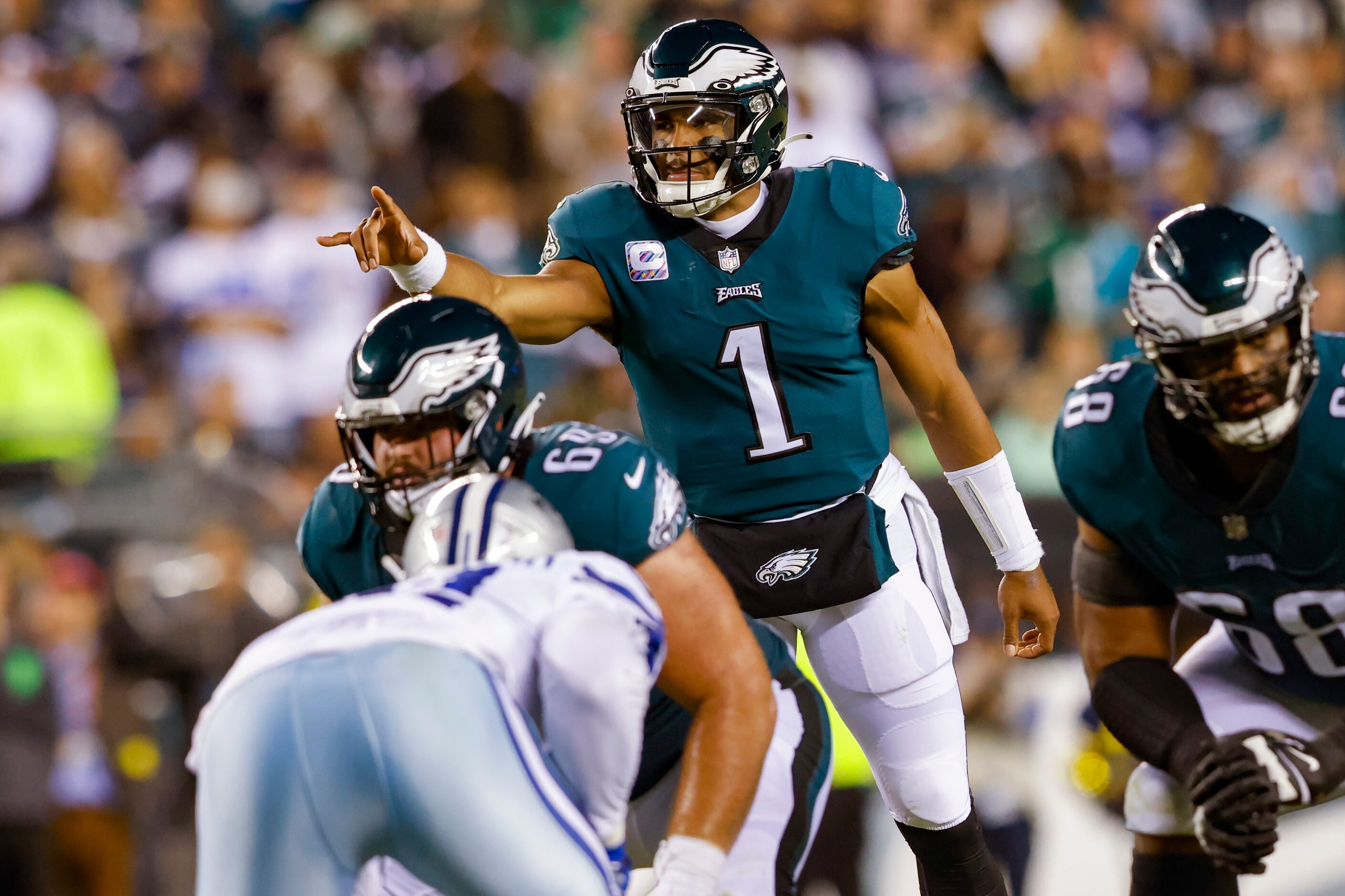 Philadelphia Eagles quarterback Jalen Hurts (1) motions before a play during the second...