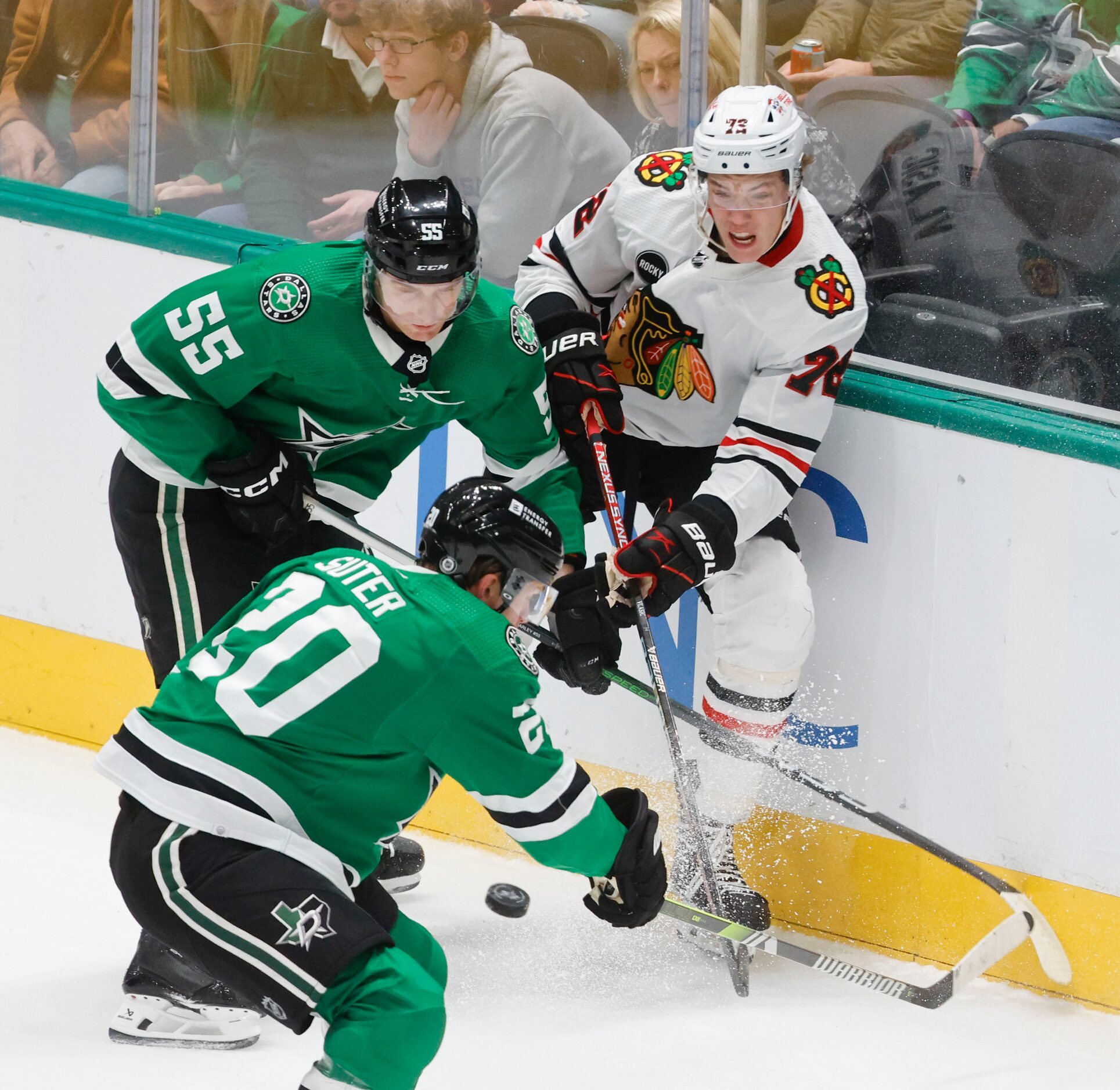 Dallas Stars defenseman Thomas Harley (55), defenseman Ryan Suter (20) and Chicago...