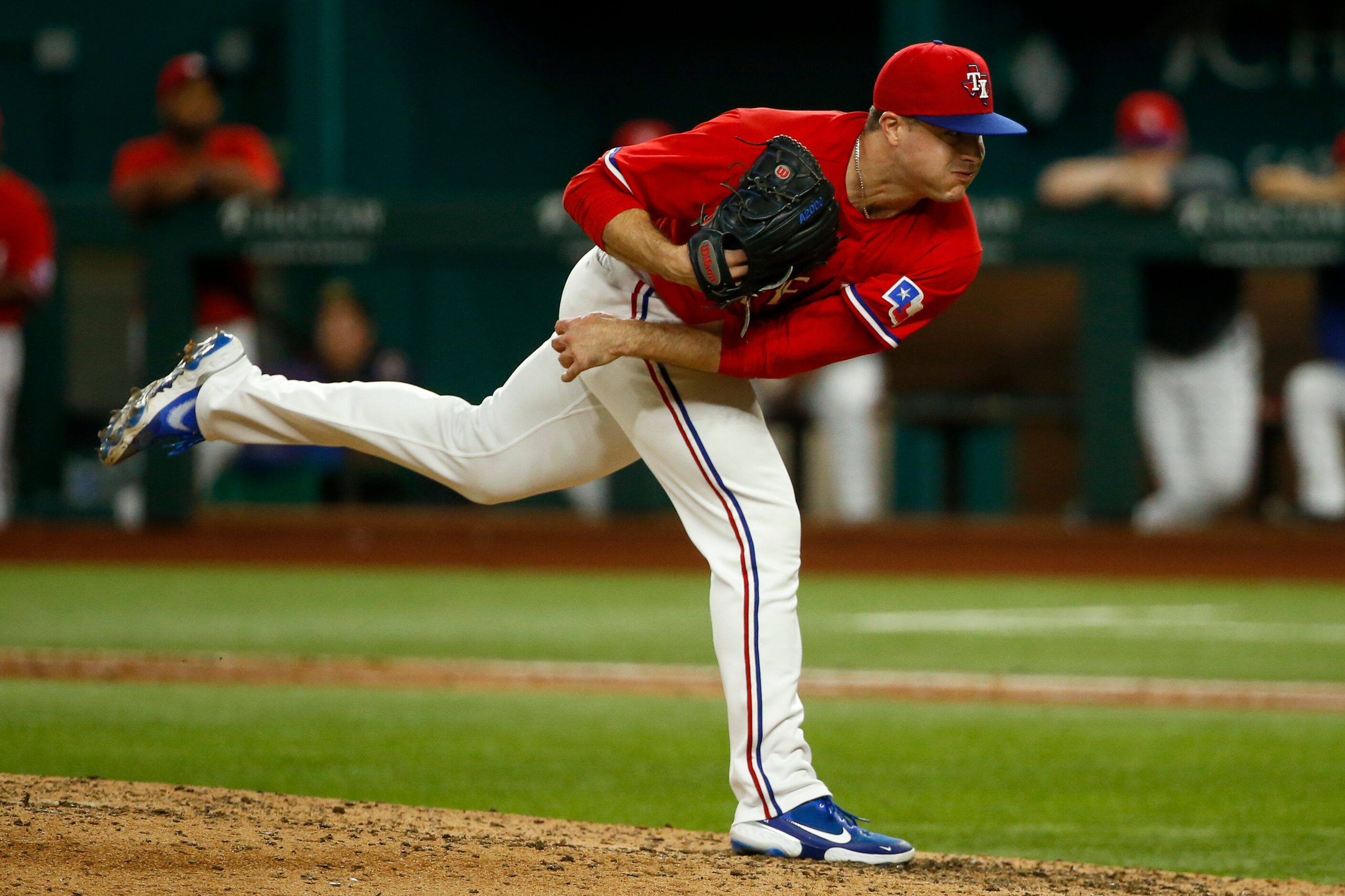 Texas Rangers relief pitcher John King (60) throws the ball during the eighth inning against...