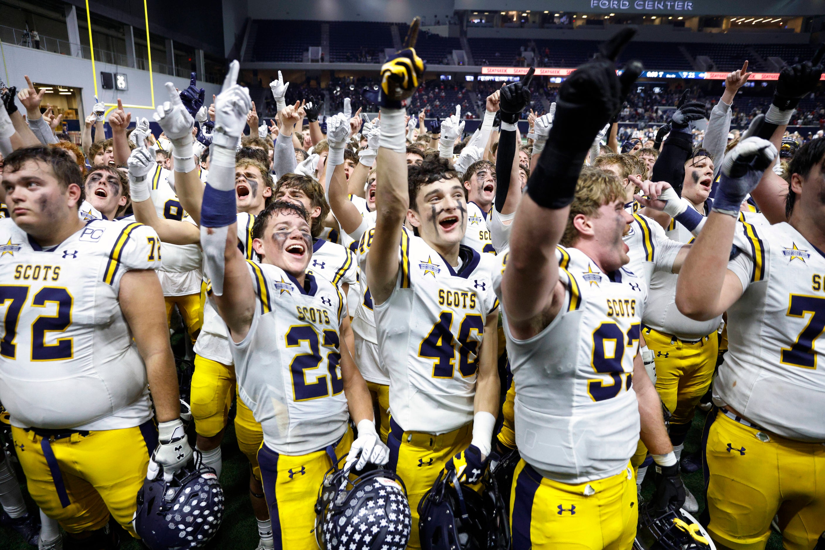 Highland Park players sing the school song as they celebrate after winning a Class 5A...