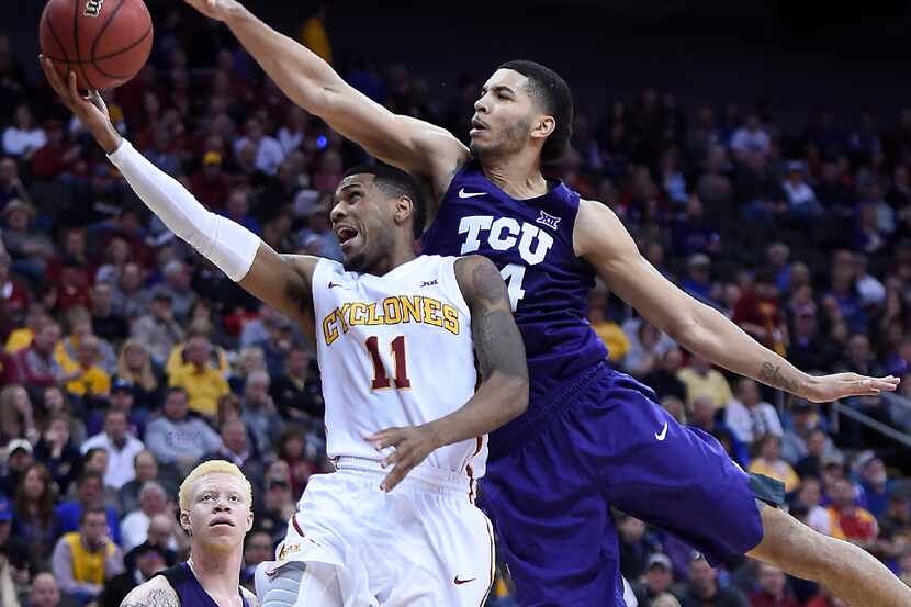 Iowa State's Monte' Morris (11) works past Texas Christian's Kenrich Williams for a shot...