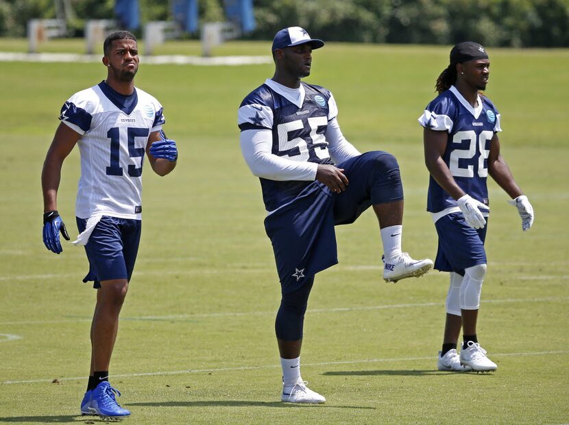 Dallas Cowboys wide receiver Devin Street (15), linebacker Rolando McClain (55) and...