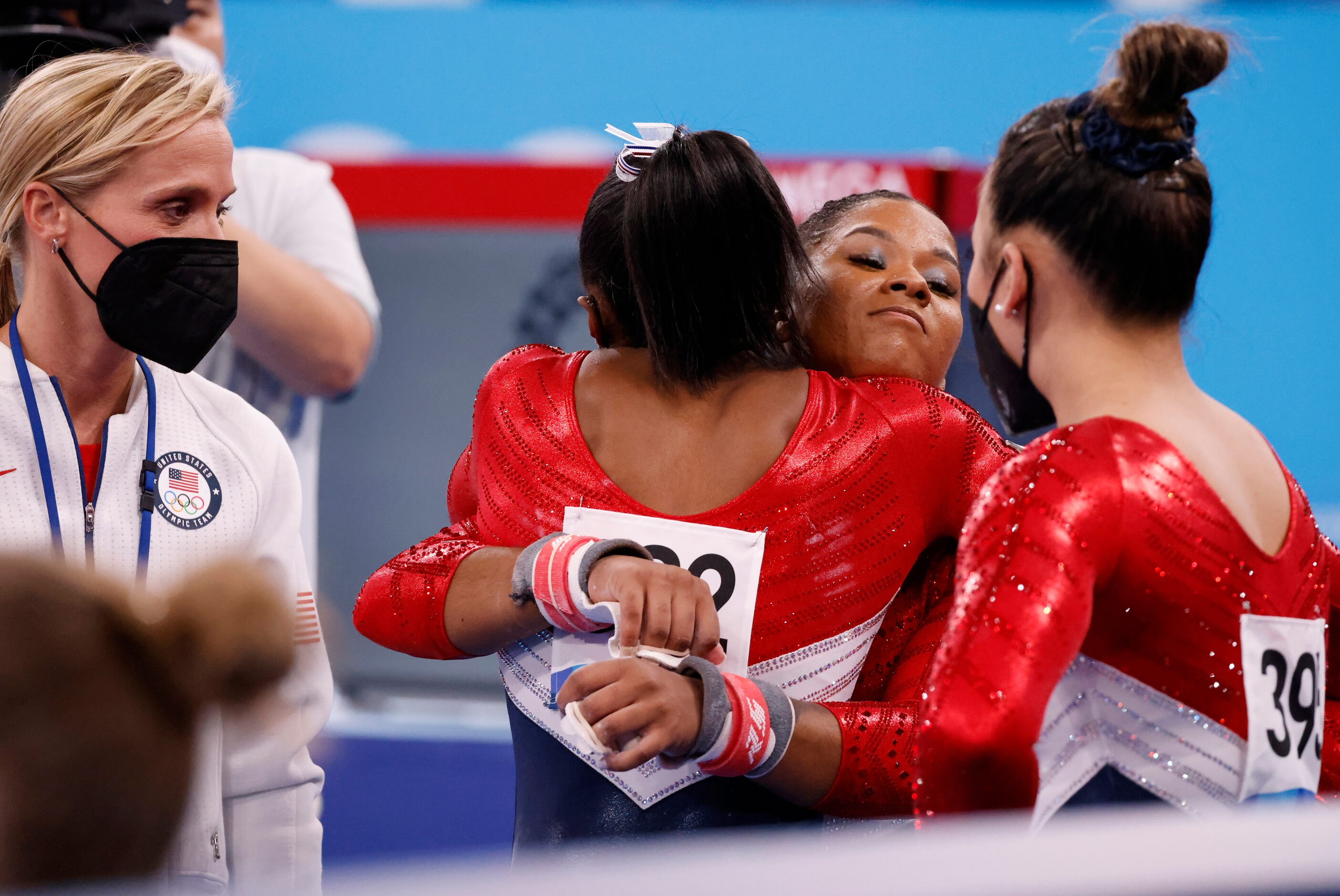 USA’s Simone Biles hugs Jordan Chiles after returning to the field of play shortly after...