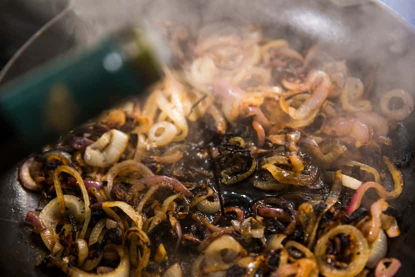 Caramelized onions are doused with balsamic vinegar.