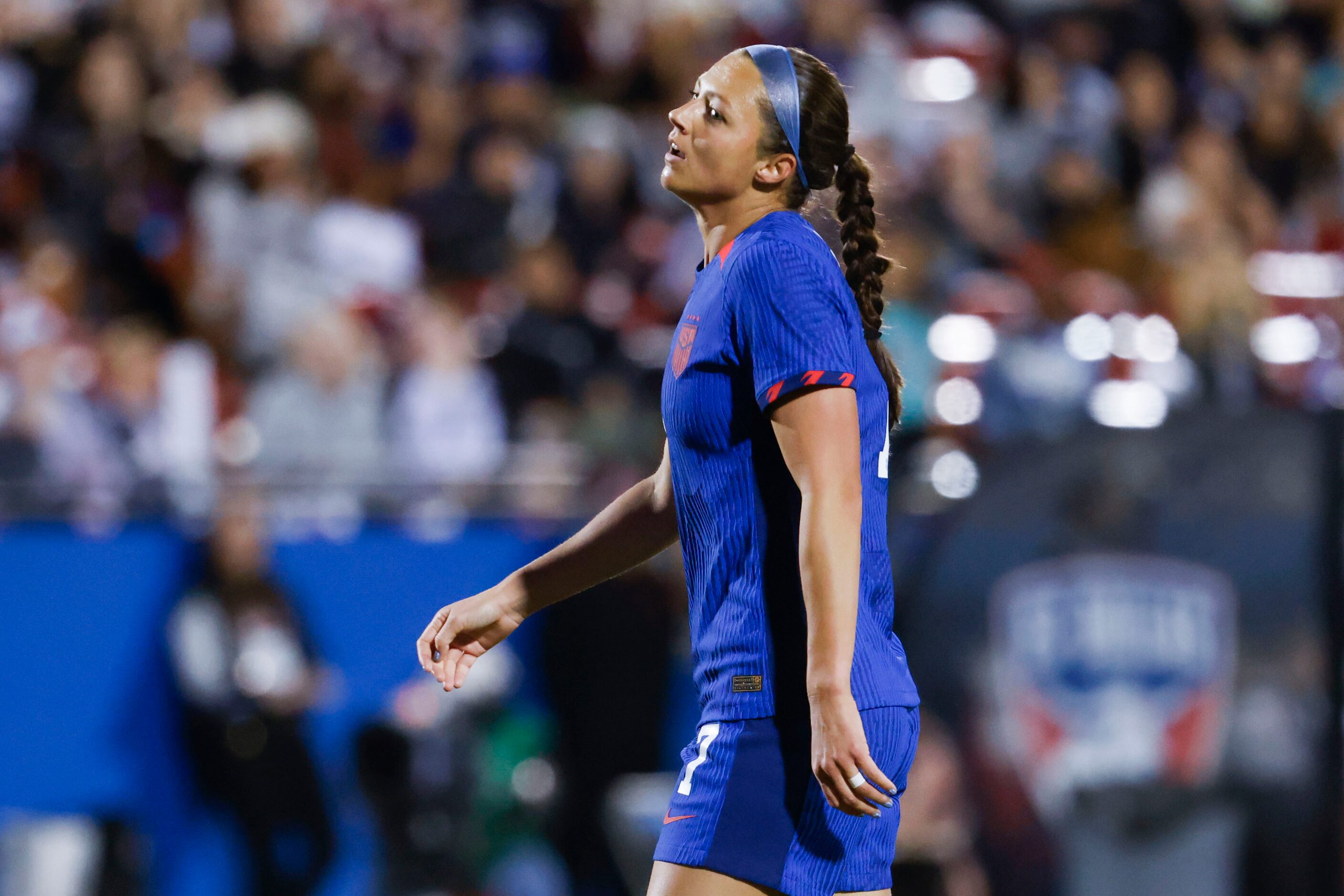 United States forward Ashley Hatch reacts after missing a goal during the first half of a...