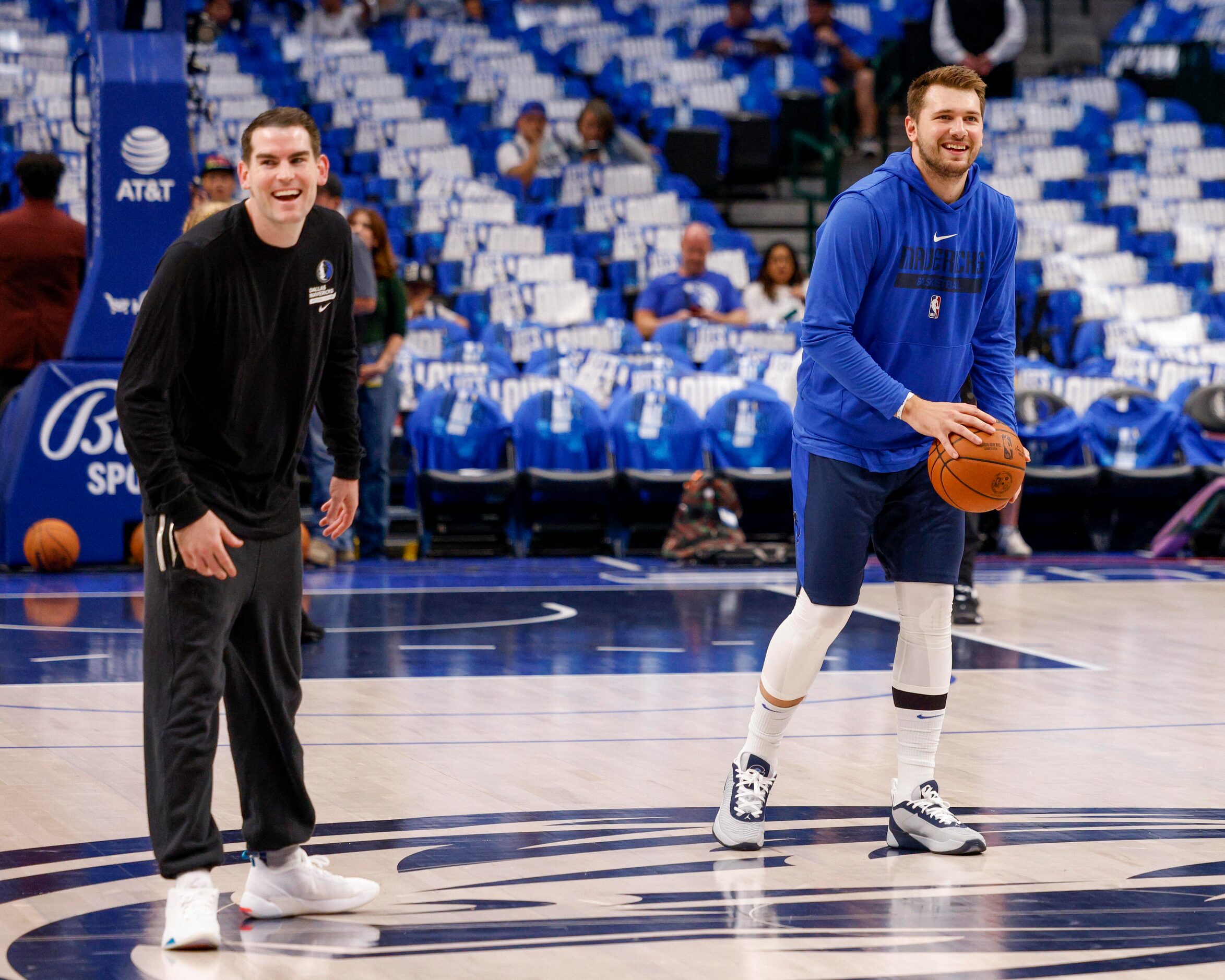 Dallas Mavericks guard Luka Doncic (77) laughs while warming up before the Mavs home opener...