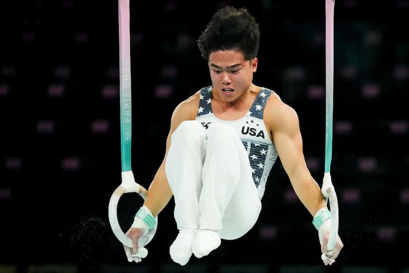 Asher Hong of the United States works on the rings during gymnastics podium training ahead...