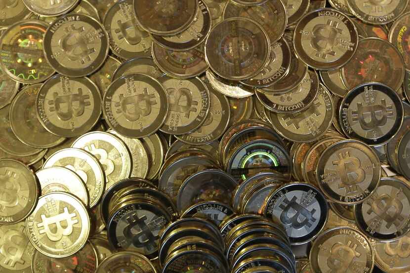 FILE - This April 3, 2013 file photo shows bitcoin tokens in Sandy, Utah. The Mt. Gox...