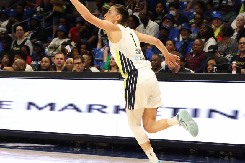 Dallas Wings guard Sevgi Uzun (1) reaches for a tall pass during first half action of the...