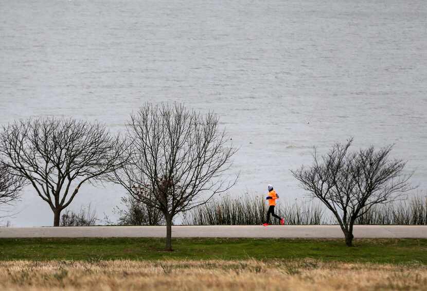 Susan Tiner ran in 24-degree weather at White Rock Lake in Dallas on the morning of March 4,...