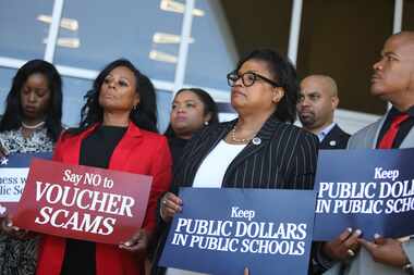 Texas House Democrats and others rally against school vouchers during a press conference at...