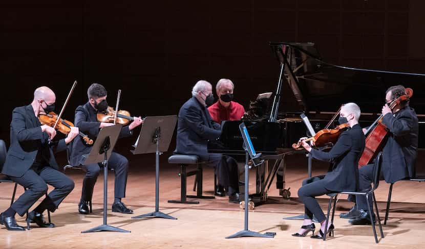 Pianist and Dallas Symphony Orchestra artist in residence Emanuel Ax, with musicians from...