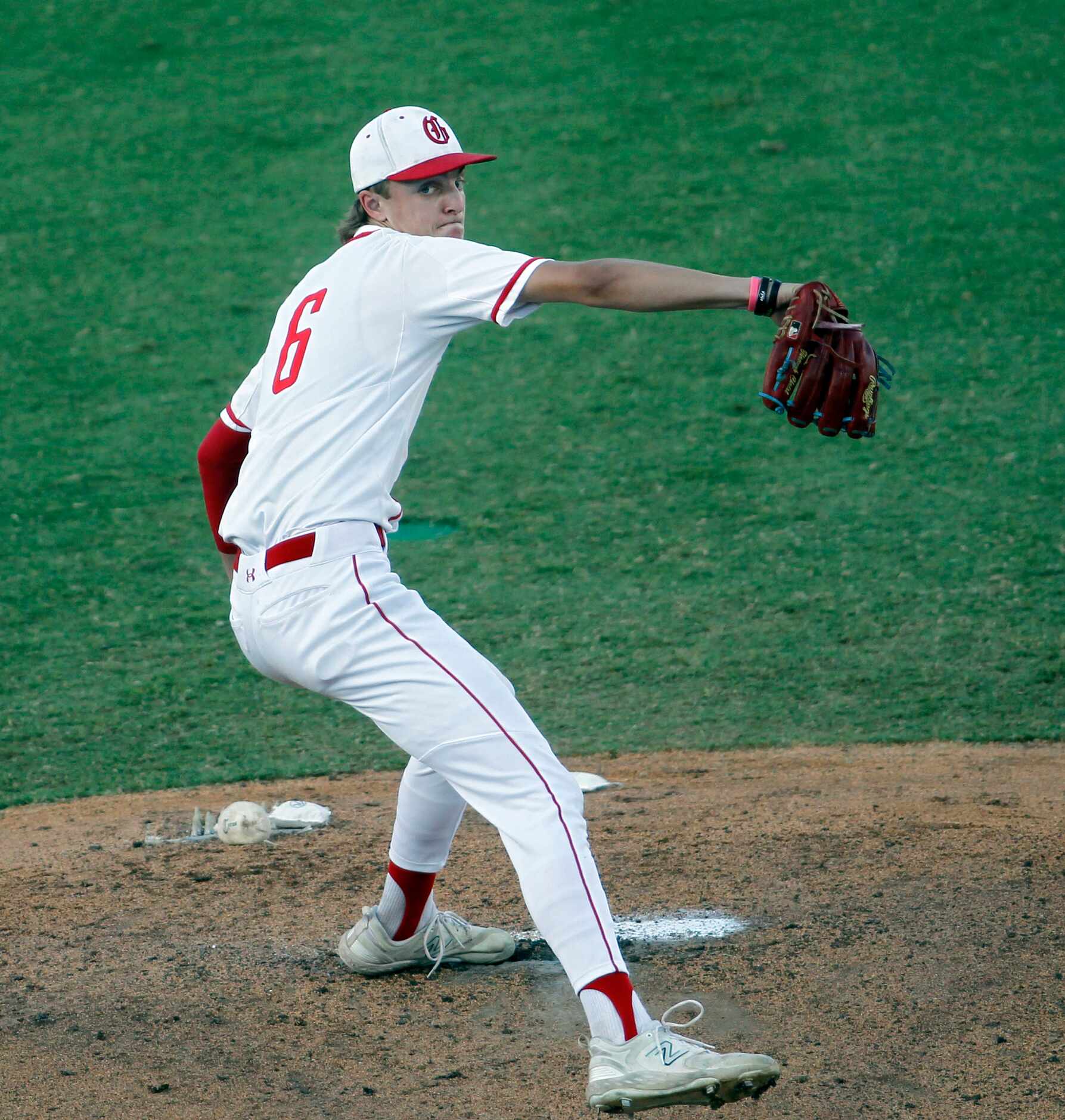 Grapevine pitcher Dasan Hill (6) delivers a pitch to a Leander Rouse batter during the top...