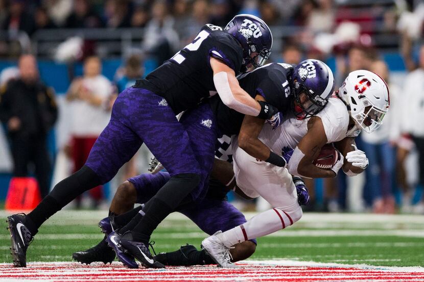 FILE - Stanford Cardinal wide receiver Connor Wedington (5) is tackled by TCU Horned Frogs...
